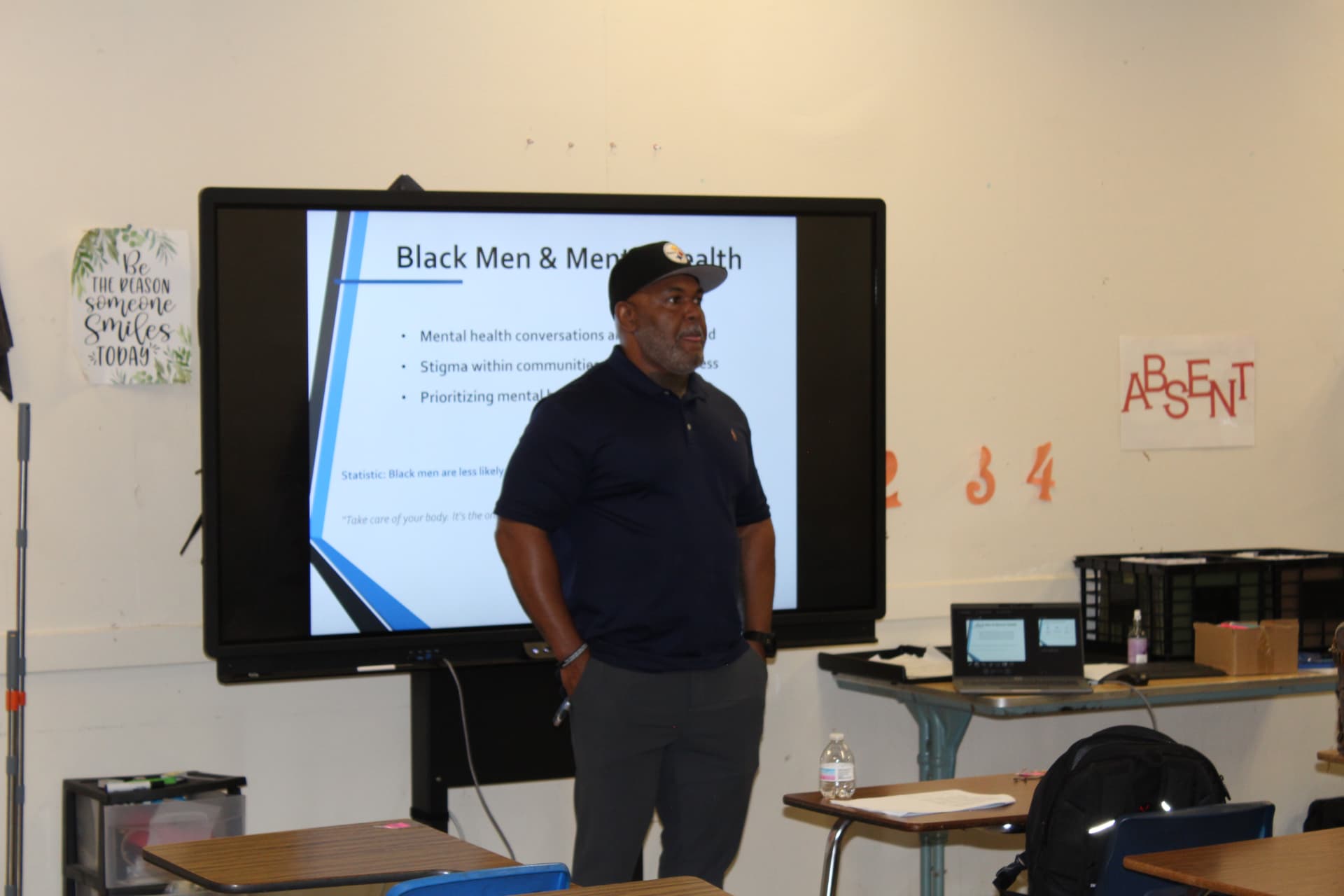 A speaker presenting a session on Black men and mental health
